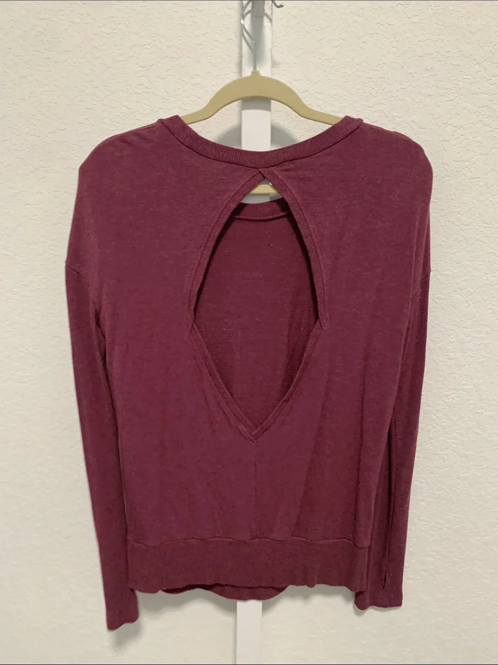 Alo Yoga Intricate Long-Sleeve Cut Out Back Crewneck Top in Wine